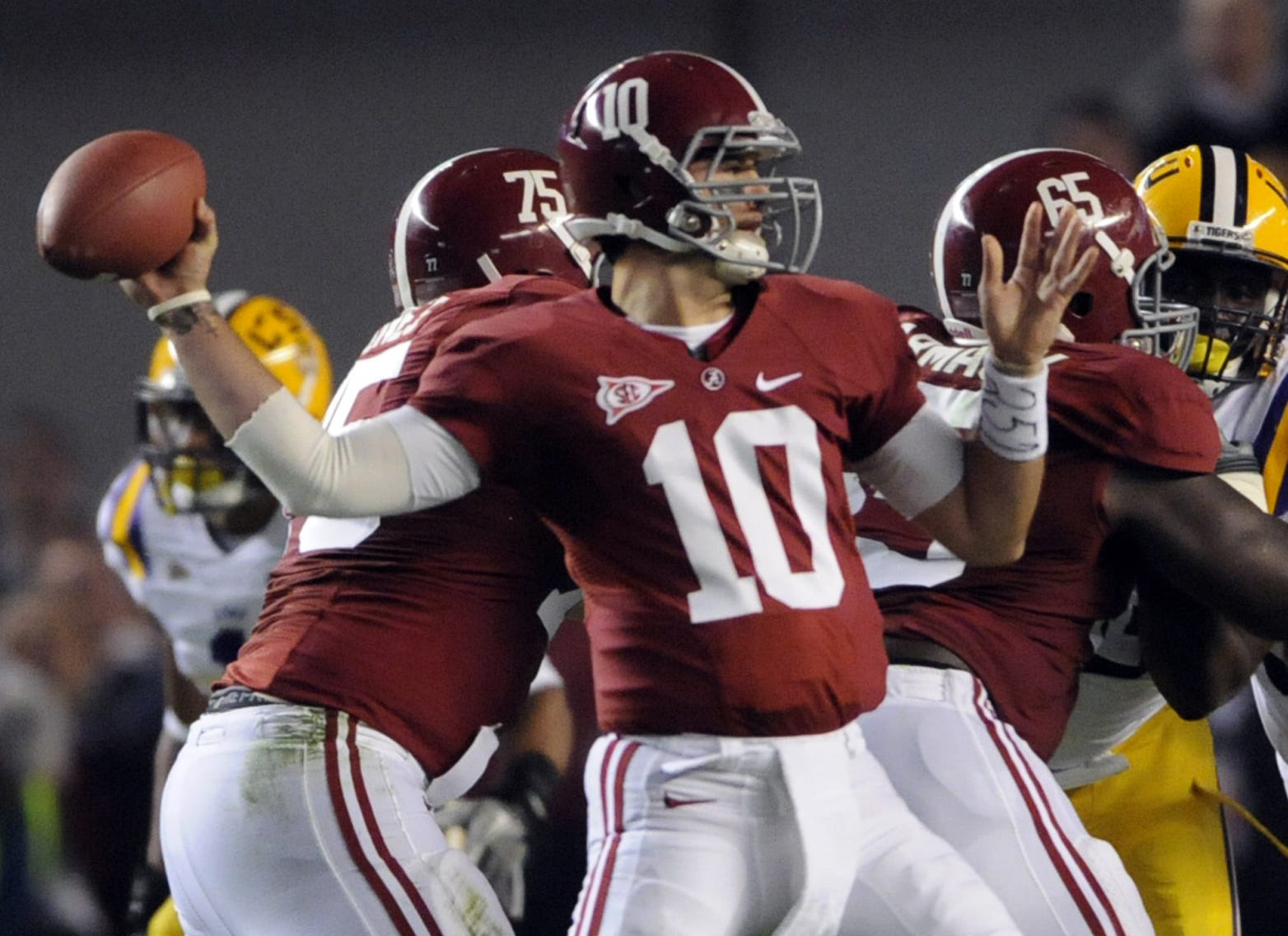 AJ McCarron attempts a pass during his Alabama career.