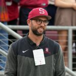 Andrew Luck of Stanford stands on the sidelines before a game.