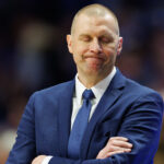 Mark Pope coaches Kentucky during a game against Arkansas.