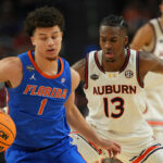 Walter Clayton Jr. dribbles.