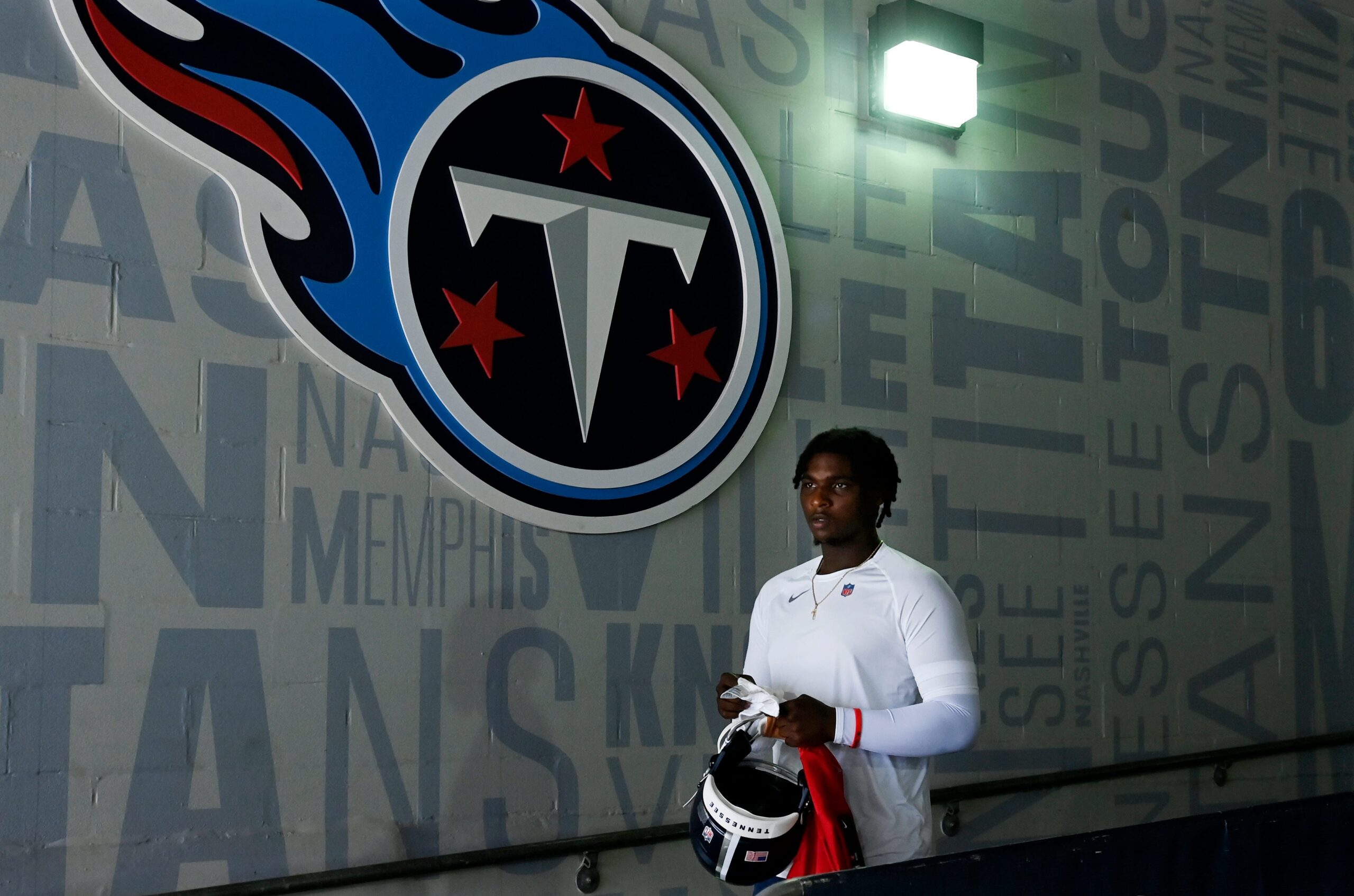 Cam Ward with the Tennessee Titans logo in the background. Best Tennessee Sports Betting Apps.