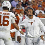 Texas coach Steve Sarkisian celebrates with QB Arch Manning.