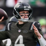 Brady Cook throws a pass.