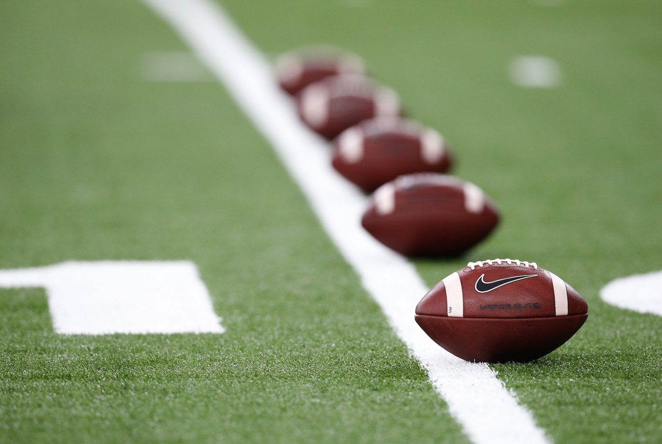 A row of Nike footballs.